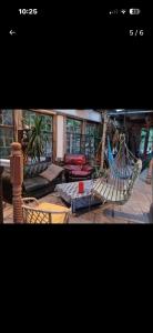 a room with a hammock and a living room at The Last Post in Wexford