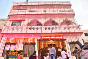 a building with people walking in front of it at Shree Videhi Atithi Grah in Ayodhya +12 photos
