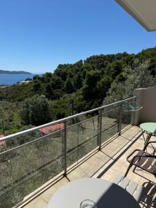 a balcony with a view of the ocean at Belvedere Village in Achladies