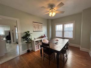 a dining room with a table and a ceiling fan at Tranquility Corner in Ashland