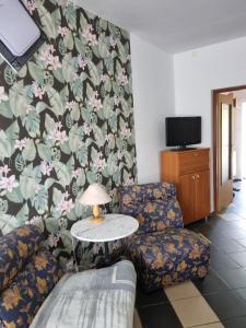 a living room with a couch and a table at Kłączyn in Kłaczno