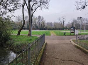 a park with a fence and a walk way at Pop Up Village in Villasanta +5 photos