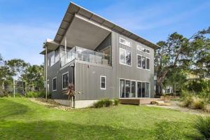 a large gray house with a lot of windows at Coastal Tree Top Views in Aireys Inlet