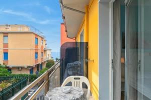 a table and chairs on the balcony of a building at Hotel Del Golfo in Laigueglia +68 photos