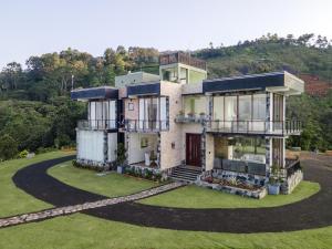 an aerial view of a house on a hill at Beverly Hills Retreat in Kandilpana