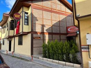 a building on the side of a street at kuyulu konak in Uşak