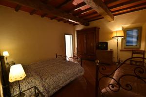 Ένα ή περισσότερα κρεβάτια σε δωμάτιο στο Agriturismo Rimaggiori relaxing country home
