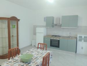 a kitchen with a table with a bowl on it at Casa Amica Termoli 1 in Termoli