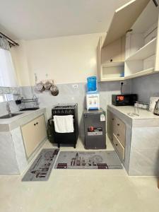 a kitchen with a sink and a stove at Sunrise Hills BNB in Ngong