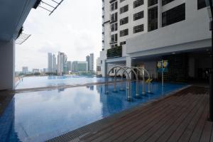 a large swimming pool in a city with buildings at Space Residency 2 bedroom 2 bathroom B59-11 in Johor Bahru