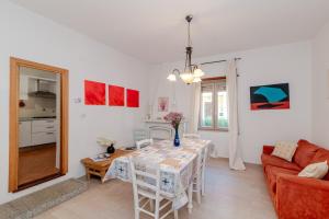 a living room with a table and a couch at De Addis Guest House in Aggius +12 photos