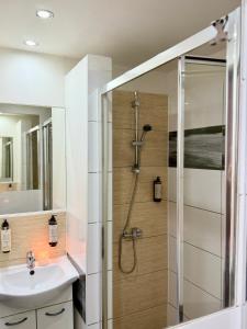 a bathroom with a shower and a sink at Pokoje Gościnne in Kołobrzeg +109 photos