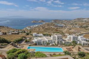 an aerial view of a resort and the ocean at Cycladic Boungainvillea Home in Kalafatis