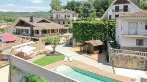 an aerial view of a house with a swimming pool at Majordoms Art in Sant Feliu de Pallerols