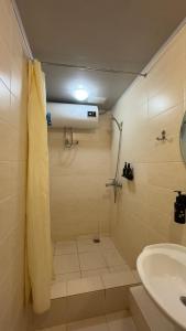 a bathroom with a shower and a sink at Art Hotel Al Hayat in Kaji-Say +129 photos