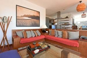 a living room with two couches in a room at Casa San Luis in Pájara