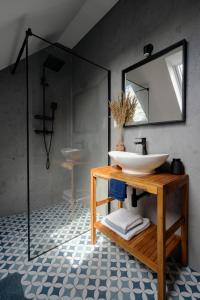 a bathroom with a sink and a mirror at Widokówka in Wetlina +27 photos