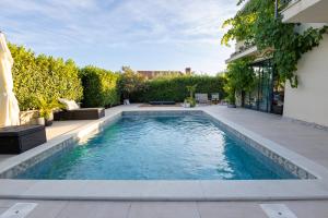 a swimming pool in the middle of a yard at Casa MiA in Linardići