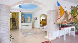 a living room with a boat on the wall at Brasilia Sweet Home in Cesenatico