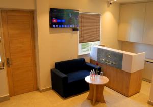 a living room with a couch and a table at Hotel Fortune Plaza in Karnal +13 photos