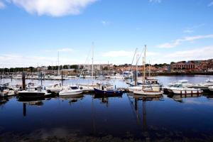 a group of boats are docked in a harbor at Host & Stay - Cobblers Cottage in Whitby