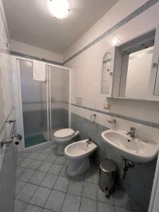 a bathroom with a toilet and a sink at Casa Giordano in Tramonti