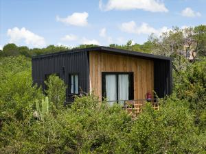 a small house in the middle of the forest at Pods at Aloe Valley, Ngobit Laikipia in Gatunga