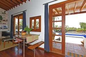 a living room with a view of a pool at Casa Simbad in Pájara