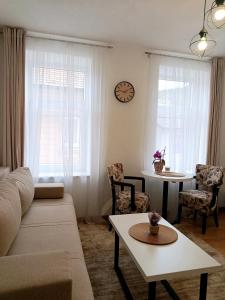 a living room with a couch and a table at Travnik Memories Apartments in Travnik