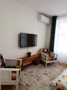 a living room with a flat screen tv on the wall at Travnik Memories Apartments in Travnik