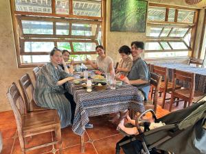 a group of people sitting around a table at The MD Ba Vi Retreat in Ba Vì