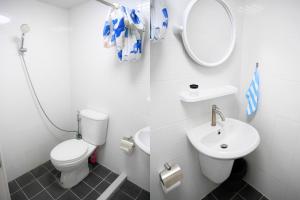 a bathroom with a toilet and a sink and a mirror at Walking distance Thunder Dome in Ban Bang Phang +20 photos