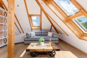 a living room with a couch and a table at Möwennest in Vitzdorf