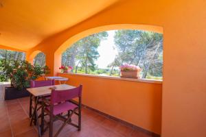 a balcony with a table and chairs and a window at Sole del Mediterraneo in Otranto +110 photos