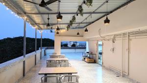 a group of tables and chairs on a patio at The Aspire Hotel Guwahati in Guwahati