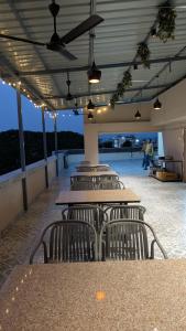 a group of tables and chairs in a building at The Aspire Hotel Guwahati in Guwahati