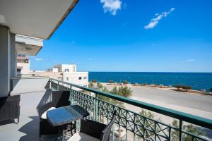 a balcony with a view of the ocean at Mareincasa Dimora Luxury in Polignano a Mare