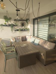 a living room with a couch and a table at Casa Fuerte y Levamt in Villaverde