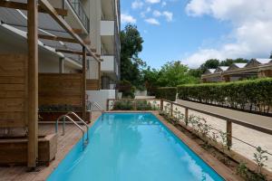 a swimming pool in the backyard of a house at Ariti Grand Hotel in Corfu
