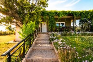 a house with a staircase leading to the front yard at Hill View 4 in Alexandroupoli