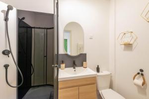 a bathroom with a shower and a sink at Casa 37 in Saint-Quentin +71 photos