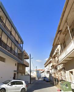 a car parked next to a building under construction at SKY Way City Apartment, 150m from Chabad Lubavitch in Larnaca +2 photos
