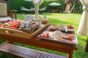 a picnic table with two plates of food on it at Sole del Mediterraneo in Otranto