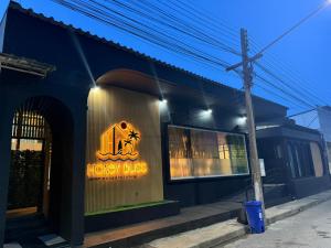 a building with a sign that reads honey blaze at Honey Bliss Pool Villa in Hat Yai