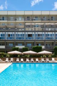 an image of a hotel with a swimming pool and umbrellas at Ariti Grand Hotel in Corfu +74 photos