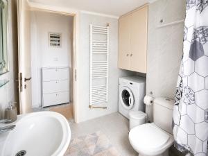 a bathroom with a toilet sink and a washing machine at Hill View 4 in Alexandroupoli +34 photos