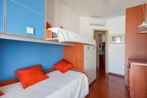 a bedroom with a bed with orange pillows at Mareincasa Dimora Luxury in Polignano a Mare +41 photos