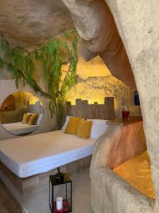 a bedroom with a bed in a cave at EmmejSuite in Pozzuoli +14 photos