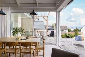 a dining room with a table and chairs at Brennik House in Port Isaac