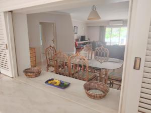 a kitchen and dining room with a table and chairs at Vale Do Lobo 935 in Loulé